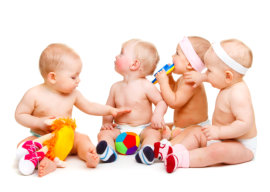 Babies group, with toys, isolated, over white