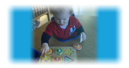 young boy playing puzzle